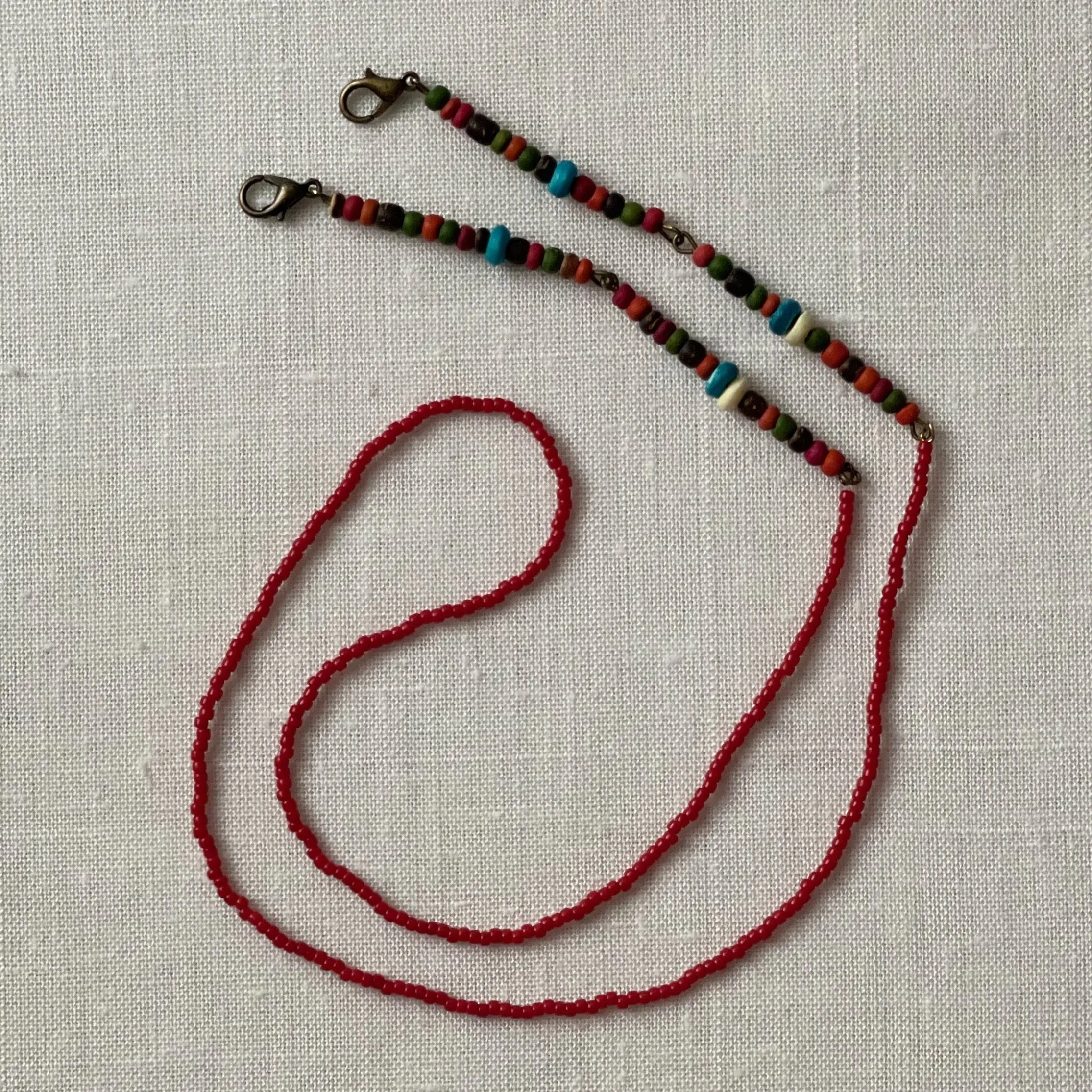 25 inch colored wood beads face mask chain with red beads and brass accents