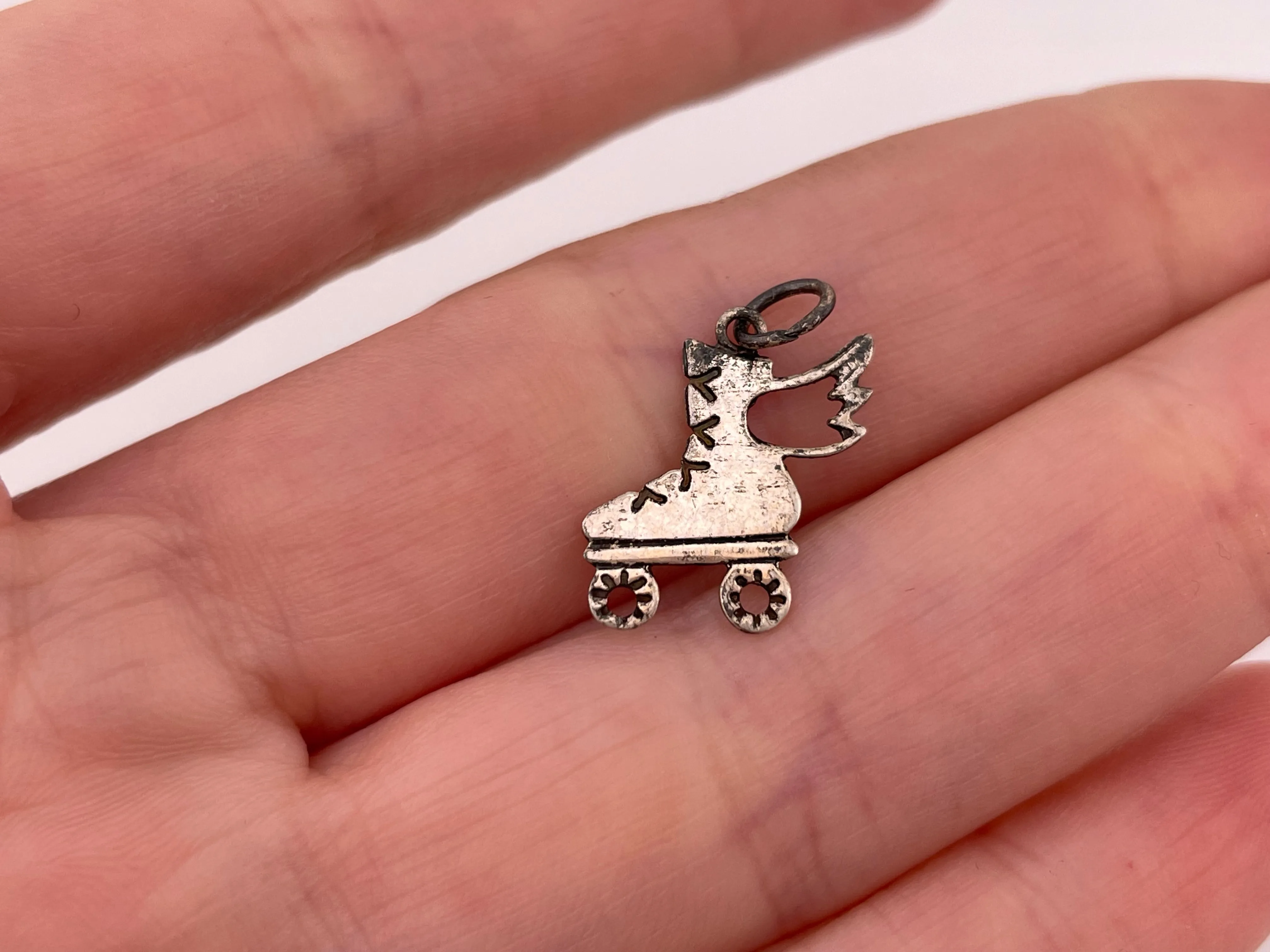 sterling silver lightweight roller skate wing pendant